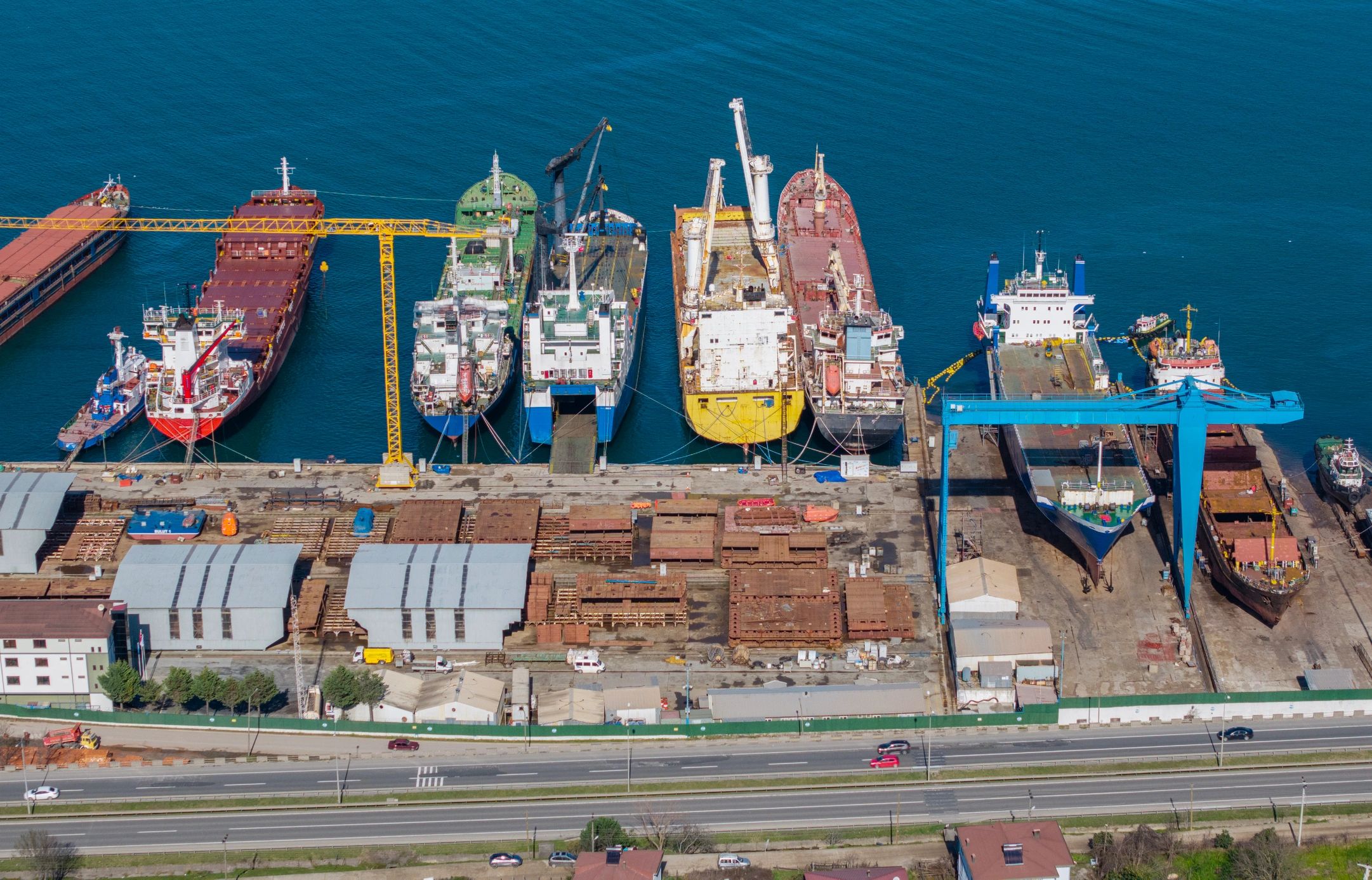 Industrial shipyard machinery and cranes representing heavy engineering capability
